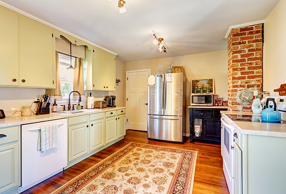 Custom kitchen cabinets Dubai with wooden island and storage drawers